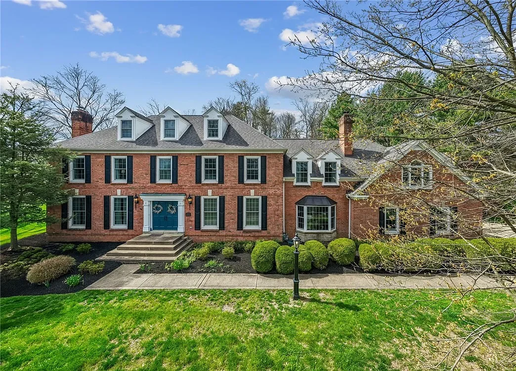 Brick home surrounded by mature trees in Murrysville, Pennsylvania